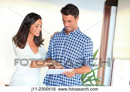 Couple with digital tablet View Large Photo Image Stock Photo - Couple with digital tablet. Fotosearch