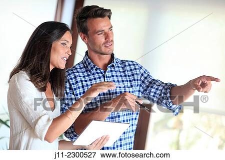 Couple with digital tablet View Large Photo Image Stock Photo - Couple with digital tablet. Fotosearch
