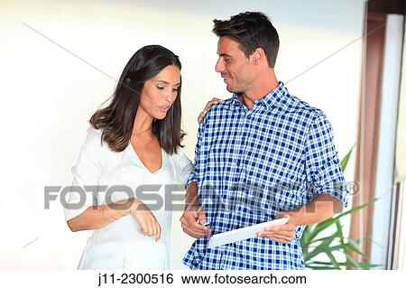Couple with digital tablet View Large Photo Image Stock Photograph - Couple with digital tablet. Fotosearch