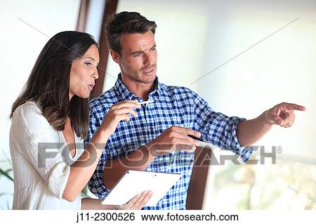 Couple with digital tablet View Large Photo Image Stock Photograph - Couple with digital tablet. Fotosearch