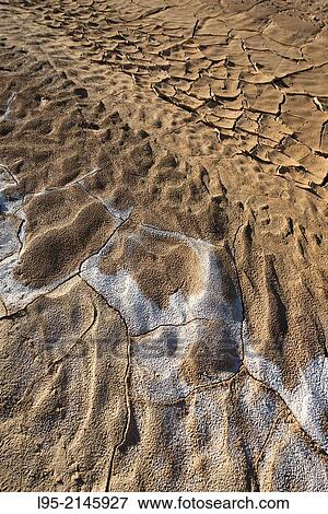 Creviced ground and salty remains on clay-only area of the natural park of Bardenas Reales de Navarra, Navarre, Spain. View Large Photo Image Stock Photo - Creviced ground and salty remains on clay-only area of the natural park of Bardenas Reales de Navarra, Navarre, Spain.. Fotosearch