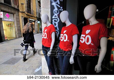 Stock Photography - Dummies indicating discount in clothing store. Barcelona. Catalonia. Spain.. Fotosearch