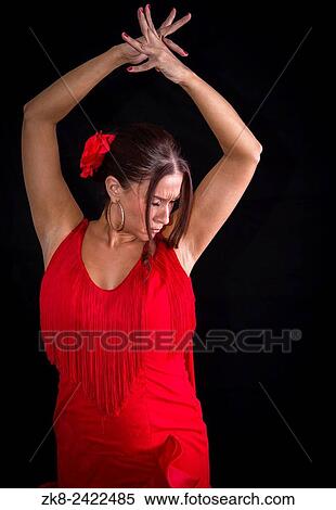 Flamenco dancer backs red dress and hands crossed up on his back on black background. View Large Photo Image Stock Photography - Flamenco dancer backs red dress and hands crossed up on his back on black background.. Fotosearch