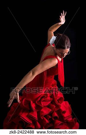 Flamenco dancer dressed in red with an expression of feeling passionate in black background. View Large Photo Image Stock Photo - Flamenco dancer dressed in red with an expression of feeling passionate in black background.. Fotosearch