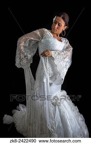 Flamenco dancer with white dress and hands crossed up on his back on black background. View Large Photo Image Stock Image - Flamenco dancer with white dress and hands crossed up on his back on black background.. Fotosearch