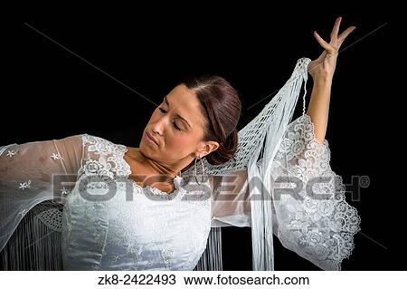 Flamenco dancer with white dress and hands crossed up on his back on black background. View Large Photo Image Stock Image - Flamenco dancer with white dress and hands crossed up on his back on black background.. Fotosearch