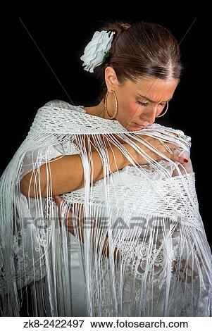 Flamenco dancer with white dress and hands crossed up on his back on black background. View Large Photo Image Stock Photo - Flamenco dancer with white dress and hands crossed up on his back on black background.. Fotosearch
