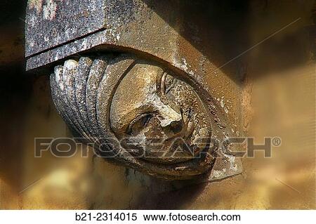 Stock Photography - France, Anjou, Figure on the romanesque kitchens of the Royal Abbey at Fontevraud.. Fotosearch