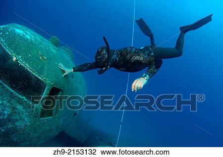 Stock Image - Freediver and wreckplan Douglas Dakota, Mediterranean Sea, Kash, Turkey.. Fotosearch