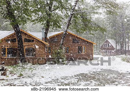 Fresh snow falling in summer at Las Cotorras resort in the Andes Mountains outside Ushuaia, Argentina. View Large Photo Image Stock Photography - Fresh snow falling in summer at Las Cotorras resort in the Andes Mountains outside Ushuaia, Argentina.. Fotosearch