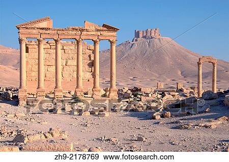 Stock Photo - Funerary temple, Dawn over the ancient city of Palmyra, Syria.. Fotosearch