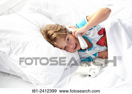 Stock Photo - girl talking on phone, in Rivadesella, Spain. Fotosearch