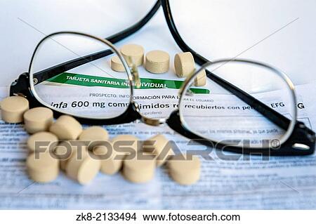 Glasses focus composition of medication, concept of prevention to read the small print of the prospectus pharmacist. View Large Photo Image Picture - Glasses focus composition of medication, concept of prevention to read the small print of the prospectus pharmacist.. Fotosearch