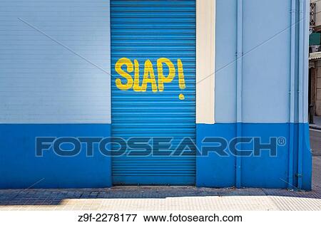 Stock Photo - Graffiti on blue door. Fotosearch