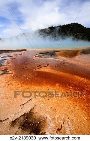 Stock Image - Grand Prismatic Spring, part of the Midway Geyser Basin in Yellowstone National Park. The Grand Prismatic Spring is the largest hot spring in the United States, and the third largest in the world.. Fotosearch