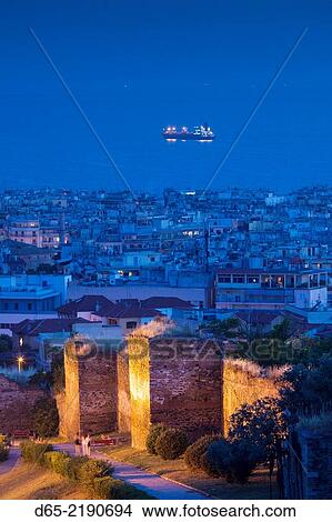Greece, Central Macedonia Region, Thessaloniki, elevated city view from the Upper Town with ancient city ramparts, dusk. View Large Photo Image Picture - Greece, Central Macedonia Region, Thessaloniki, elevated city view from the Upper Town with ancient city ramparts, dusk.. Fotosearch