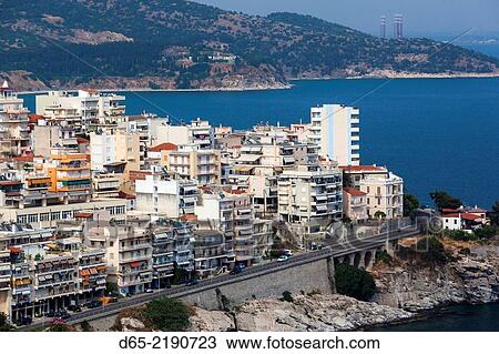 Stock Image - Greece, East Macedonia and Thrace Region, Kavala, elevated city view from Kastro fortress, late afternoon.. Fotosearch
