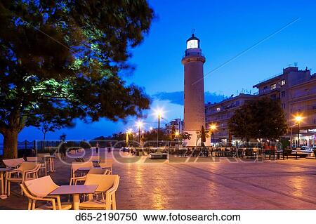 Stock Image - Greece, East Macedonia and Thrace Region, Alexandroupoli, the town lighthouse, dusk.. Fotosearch