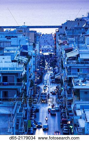 Greece, Peloponese Region, Patra, elevated city view over Agios Nikolaos Street, dusk. View Large Photo Image Picture - Greece, Peloponese Region, Patra, elevated city view over Agios Nikolaos Street, dusk.. Fotosearch