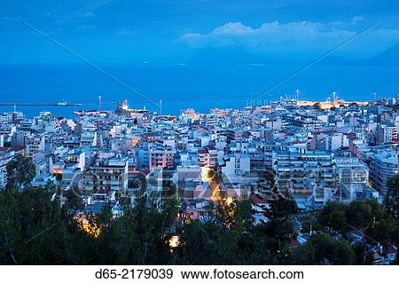 Stock Photo - Greece, Peloponese Region, Patra, elevated city view, dawn.. Fotosearch