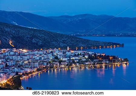 Greece, West Macedonia Region, Kastoria, elevated town view by Lake Orestiada, dusk. View Large Photo Image Stock Image - Greece, West Macedonia Region, Kastoria, elevated town view by Lake Orestiada, dusk.. Fotosearch