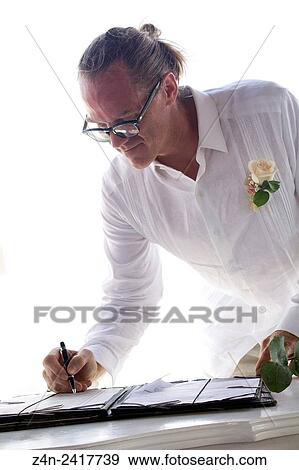 Groom signing, 35-40 years, WASP. View Large Photo Image Stock Photo - Groom signing, 35-40 years, WASP.. Fotosearch