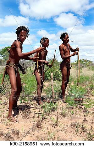 Group of Ju/´hoansi San men on a hunting trip in the African savannah and getting ready for shooting, Namibia, Africa. View Large Photo Image Stock Image - Group of Ju/´hoansi San men on a hunting trip in the African savannah and getting ready for shooting, Namibia, Africa.. Fotosearch