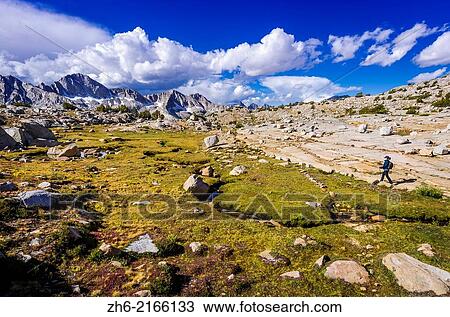Hiker on the Bishop Pass trail in Dusy Basin, Kings Canyon National Park, California USA. View Large Photo Image Stock Image - Hiker on the Bishop Pass trail in Dusy Basin, Kings Canyon National Park, California USA.. Fotosearch