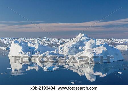 Picture - Huge icebergs calved from the Ilulissat Glacier, a UNESCO World Heritage Site, Ilulissat, Greenland.. Fotosearch