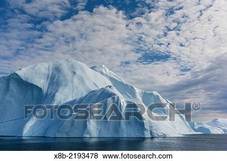 Huge icebergs calved from the Ilulissat Glacier, a UNESCO World Heritage Site, Ilulissat, Greenland. View Large Photo Image Stock Photo - Huge icebergs calved from the Ilulissat Glacier, a UNESCO World Heritage Site, Ilulissat, Greenland.. Fotosearch