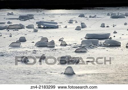 Ice Blocks on an Artificial Lake in Botanica Public Park in Bad Schallerbach. Austria. View Large Photo Image Stock Photo - Ice Blocks on an Artificial Lake in Botanica Public Park in Bad Schallerbach. Austria.. Fotosearch