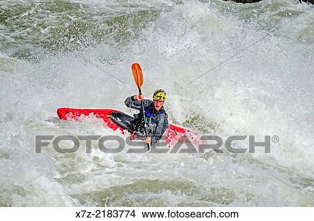 Kayaking the Drop which is rated Class 5 on the Milner Mile section of the Snake River near the town of Murtaugh in southern Idaho. View Large Photo Image Picture - Kayaking the Drop which is rated Class 5 on the Milner Mile section of the Snake River near the town of Murtaugh in southern Idaho.. Fotosearch