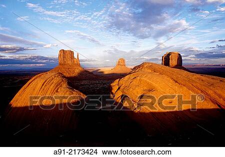 Picture - Landscape of red mesas at dusk. Monument valley, Navajo reservation. Utah. United states (USA).. Fotosearch