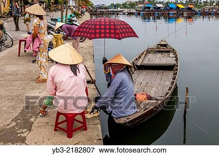 Local Women Wait For Tourists To Take Out On River Boat Trips, Hoi An, Quang Nam Province, Vietnam. View Large Photo Image Stock Photo - Local Women Wait For Tourists To Take Out On River Boat Trips, Hoi An, Quang Nam Province, Vietnam.. Fotosearch