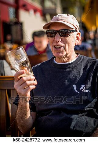 man, 60, drinks beer in Vancouver, BC, Canada. View Large Photo Image Stock Image - man, 60, drinks beer in Vancouver, BC, Canada.. Fotosearch