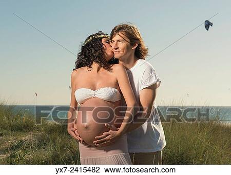 Man and pregnant woman at the beach. Tarifa, Costa de la Luz, Cadiz, Andalusia, Spain, Europe. View Large Photo Image Stock Image - Man and pregnant woman at the beach. Tarifa, Costa de la Luz, Cadiz, Andalusia, Spain, Europe.. Fotosearch