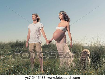 Man and pregnant woman at the beach. Tarifa, Costa de la Luz, Cadiz, Andalusia, Spain, Europe. View Large Photo Image Stock Image - Man and pregnant woman at the beach. Tarifa, Costa de la Luz, Cadiz, Andalusia, Spain, Europe.. Fotosearch