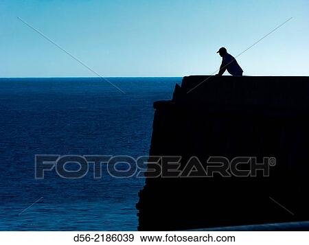 Man looking at the sea, Tabarca Island, Alicante, Spain. View Large Photo Image Stock Photo - Man looking at the sea, Tabarca Island, Alicante, Spain.. Fotosearch
