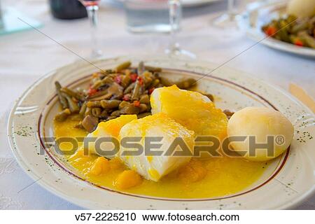Stock Image - Mediterranean diet: cod with vegetables.. Fotosearch