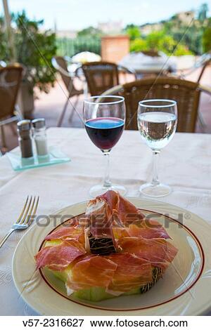Melon with ham serving in a terrace. Toledo, Spain. View Large Photo Image Stock Photo - Melon with ham serving in a terrace. Toledo, Spain.. Fotosearch