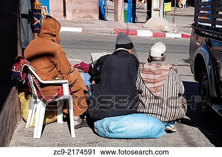Men talking on the streets, Morocco. View Large Photo Image Stock Image - Men talking on the streets, Morocco.. Fotosearch