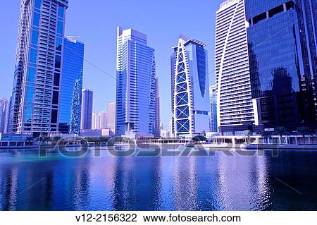 Modern high-rise apartment towers at Jumeirah Lakes Towers JLT at Dubai, UAE. View Large Photo Image Stock Image - Modern high-rise apartment towers at Jumeirah Lakes Towers JLT at Dubai, UAE.. Fotosearch