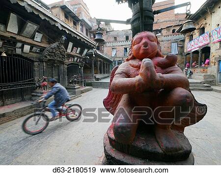 Stock Photo - Nepal. Bakhtapur, an historic town in the Kathmandu Valley and UNESCO world heritage site. Vishnu statue and temple.. Fotosearch