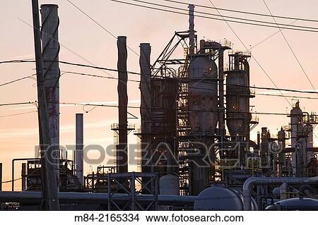 Oil and gas refinery at sunset, Montreal, Quebec, Canada. View Large Photo Image Picture - Oil and gas refinery at sunset, Montreal, Quebec, Canada.. Fotosearch