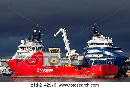 Oil platform support vessels alongside Montrose Docks Scotland UK. View Large Photo Image Stock Photograph - Oil platform support vessels alongside Montrose Docks Scotland UK.. Fotosearch