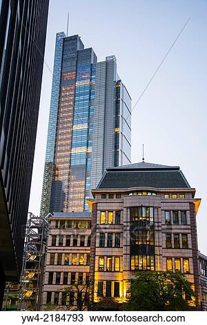 Stock Image - Old and new buildings illuminated at dusk, City of London, England, UK.. Fotosearch