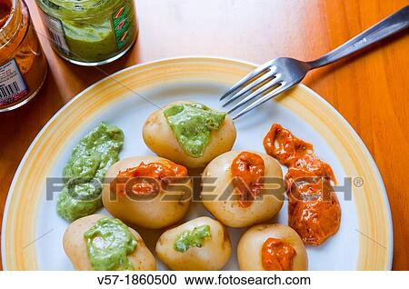 Stock Image - Papas arrugadas with mojo sauce. Canary Islands, Spain.. Fotosearch