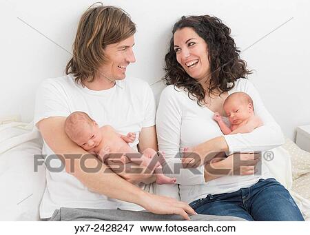 Parents with new born twins. View Large Photo Image Stock Photo - Parents with new born twins.. Fotosearch