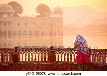 Stock Photo - People arriving at Man Sagar lake by sunrise.. Fotosearch