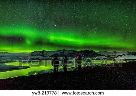 Photographing the Aurora Borealis or Northern lights, Jokulsarlon, Breidamerkurjokull, Vatnajokull Ice Cap, Iceland. View Large Photo Image Stock Image - Photographing the Aurora Borealis or Northern lights, Jokulsarlon, Breidamerkurjokull, Vatnajokull Ice Cap, Iceland.. Fotosearch